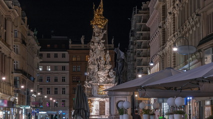 People is walking in Graben St. night timelapse, old town main street of Vienna, Austria.