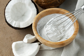 image of coconut cream or butter and coconuts at background
