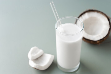 image of fresh half and whole coconuts with coconut non dairy milk