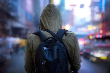 Back view of  man posing with winter hood on road