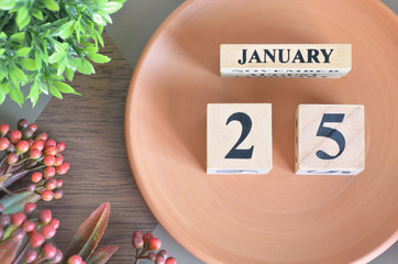 January 25, month design with flower and earthenware.