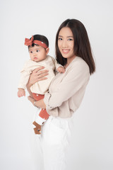 Asian mother and adorable baby girl are  happy on white background
