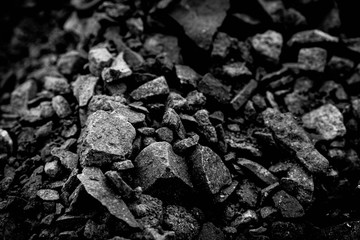 A heap of black natural coal, photo of coal mine background, texture