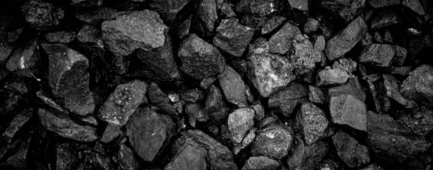 Foto op Canvas A heap of black natural coal, photo of coal mine background, texture © kheartmanee
