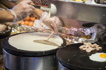 French chef cooking traditional galette in Rennes ,France.
