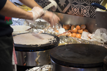 French chef cooking traditional galette in Rennes ,France.