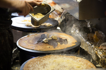 French chef cooking traditional galette in Rennes ,France.
