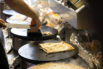 French chef cooking traditional galette in Rennes ,France.