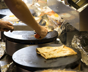 French chef cooking traditional galette in Rennes ,France.