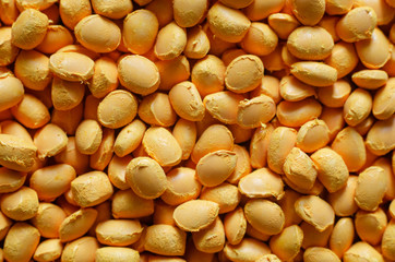 Yellow polymer dye in granules, background texture