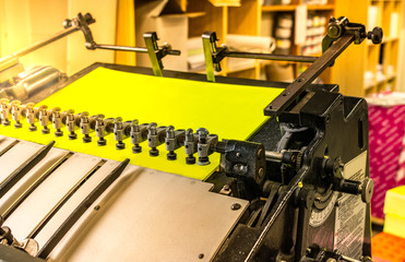 Detail of printing machine, metallic pieces of paper suction
