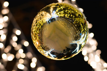 Christmas decoration. Background with xmas ball and bokeh lights.