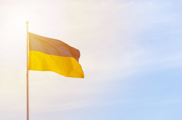 Blue yellow flag of Ukraine against the sky.