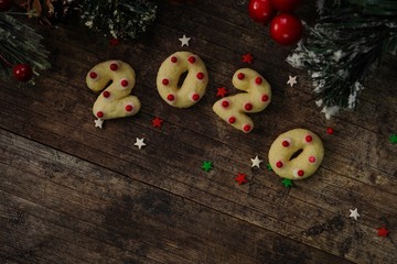 2020 shaped  new year sugar cookies on rustic wooden background