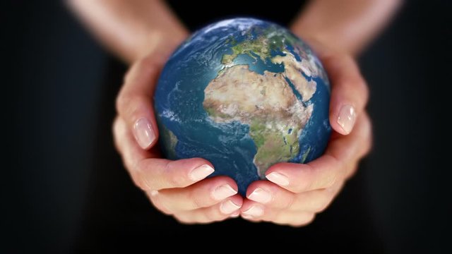 Female hand holding a realistic Earth. Starting in Europe. Hands with spinning Earth. The Earth globe start showing Europe and is loopable from frame 98 to frame 547. 
