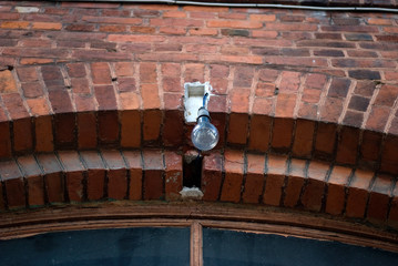 Fragment of the historical building. Authentic masonry brickwall facade and other details