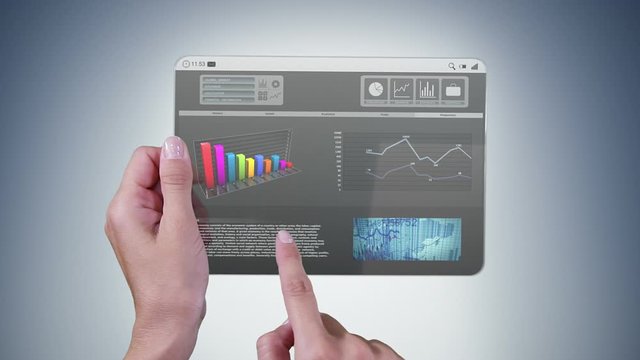 Futuristic mini-tablet with financial data. Woman using a futuristic digital tablet. Financial diagram videos on the screen. Alpha matte. More options in my portfolio.