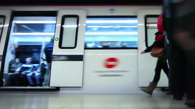 Subway station. Time lapse. Lateral dolly. Loopable. Subway train arriving. Visible logos and faces were blurred. More options in my portfolio.  