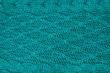 Texture knitting. Blue pullover. Pattern fabric made of wool. Background. Trending color in fashion design in the year 2020.