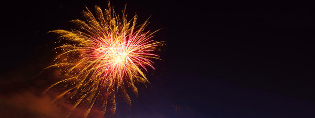 Ultra wide panoramic night shot of beautiful slow shutter fireworks as seen during festive celebration