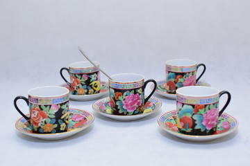 Mock up / design set of elegant and traditional colorful coffee cup & Tea cup on cup's plate , drink-ware , kitchen isolated on white background 