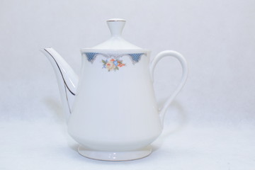 Mock up / design set of elegant and traditional teapot colorful white and blue coffee cup & Tea cup on cup's plate beside the hot tea pot , design/ drink-ware isolated on white background