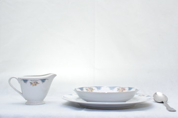Mock up / design set of elegant and traditional  colorful white and blue dishware and dork knife spoon  , design/ dining-ware and food plates and bowl isolated on white background