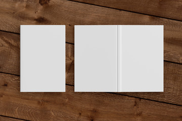 Blank white vertical closed and open and upside down book cover on wooden boards isolated with clipping path around cover. 3d illustration