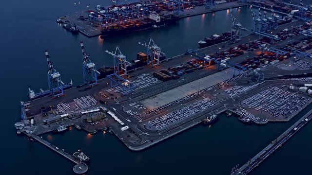 Containers loading in  industrial port (Haifa, Israel), 4k aerial drone view