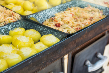 All sorts of pickled vegetables on display at a street food market