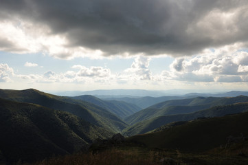 Naklejka premium landscape with mountains and clouds