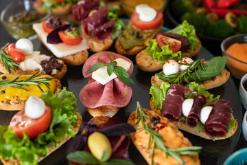 Many kinds of appetizer on the black table