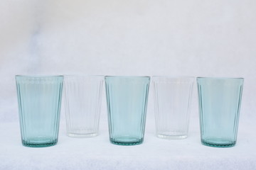 Mockup and design set of blue and transparent water glass.  template for branding identity and...
