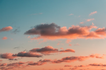 orange clouds in the light of raspberry sunset