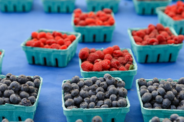 Blueberries in paper containers on food market