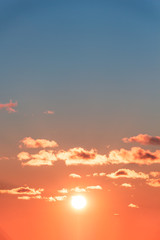 lush red sunset illuminates the clouds against a turquoise sky