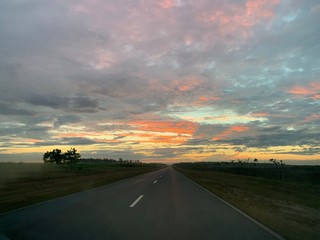 Endless road in Cuba, sunset