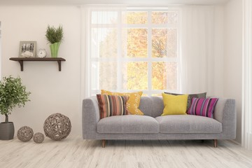 Stylish room in white color with sofa and autumn landscape in window. Scandinavian interior design. 3D illustration