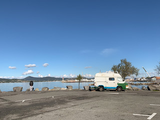 Small vintage van on the parking by the sea