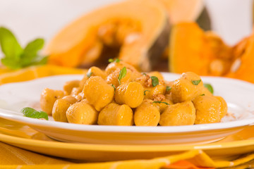 Pumpkin gnocchi with grated amaretti cookies.