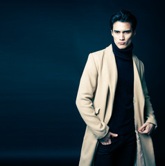 Obraz na płótnie Canvas handsome asian fashion looking man posing in studio on black background, lifestyle modern people concept