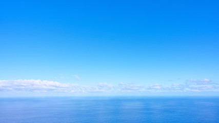 Panorama of the sea with clouds above the horizon