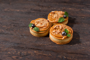 tart with salted caramel french dessert. Food industry, mass or volume production.
