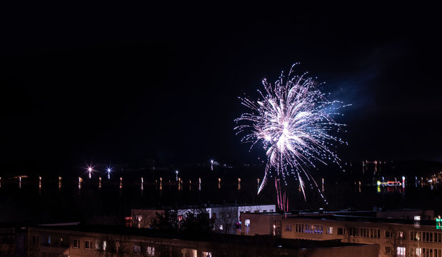 Blue New Year Fireworks Above City District House