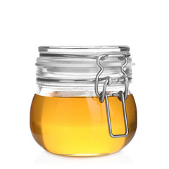 Jar of organic honey isolated on white