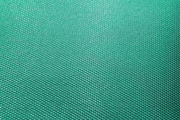 Close-up abstract flat light blue high detail textured clothing fabric pattern background partial focus realistic light