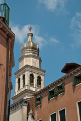 Fototapeta na wymiar Venice, Italy: Tower of church Sant'Antonin, a church in the sestiere (district) of Castello