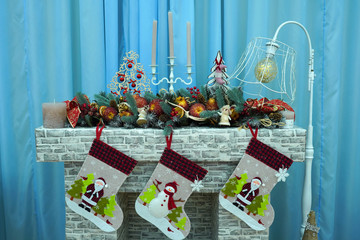 Christmas fireplace with Santa socks, candles and decorations