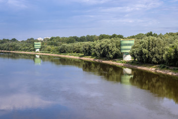 Bank of Vistula river with water treatment buildings seen from Siekierkowski Bridge in Warsaw, Poland