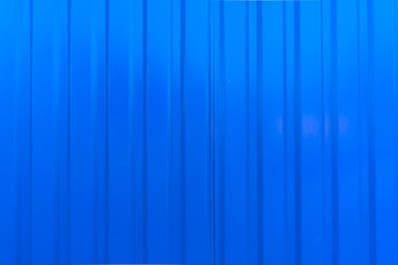 Detailed texture. Blue corrugated board, abstract metal background.